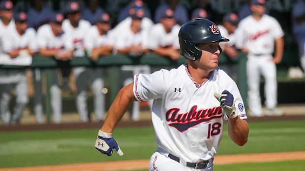Auburn freshman Ike Irish checks on his home run ball against Louisiana Tech in fall exhibition action